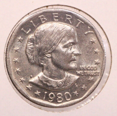 1980-S Susan B. Anthony dollar struck on nickel planchet showing bright silver-white color versus standard copper-nickel example